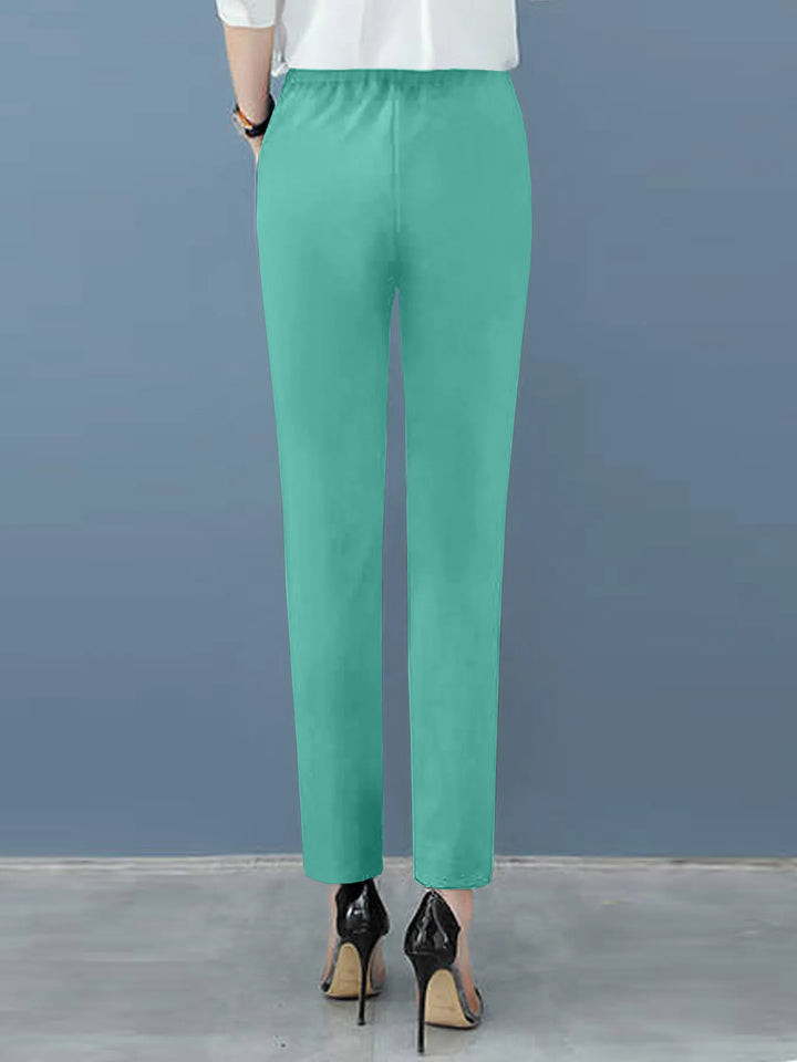 Women's dress pants: elegant high waist, sophisticated pleats, and a sleek tapered leg for work or events.