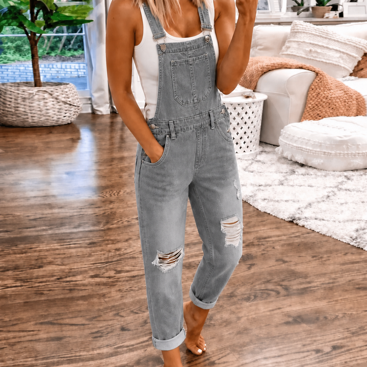 Stylish women's relaxed straight leg jumpsuit. Casual overall design with a functional bib pocket. Versatile for spring.