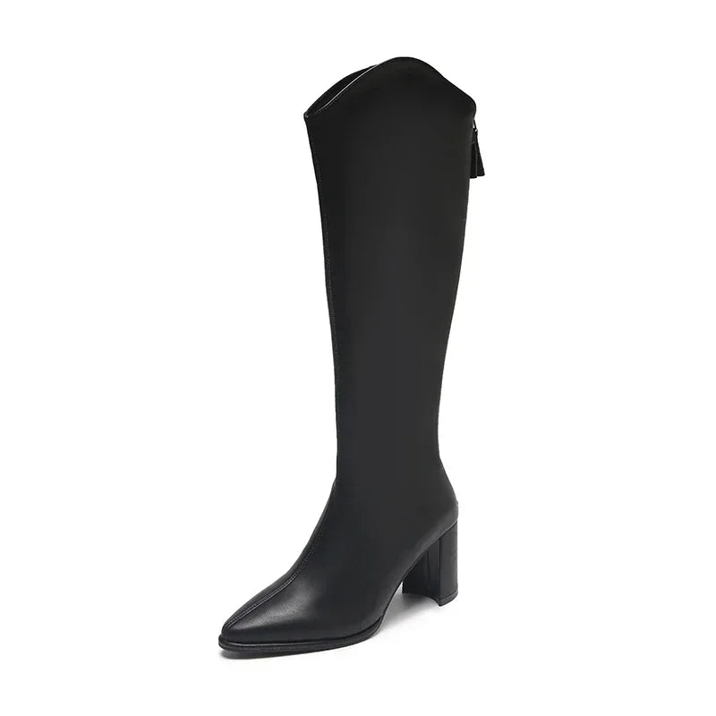 Women's elegant knee-high boots. Pointed toe, sturdy block heel, & discrete back zip closure detail.