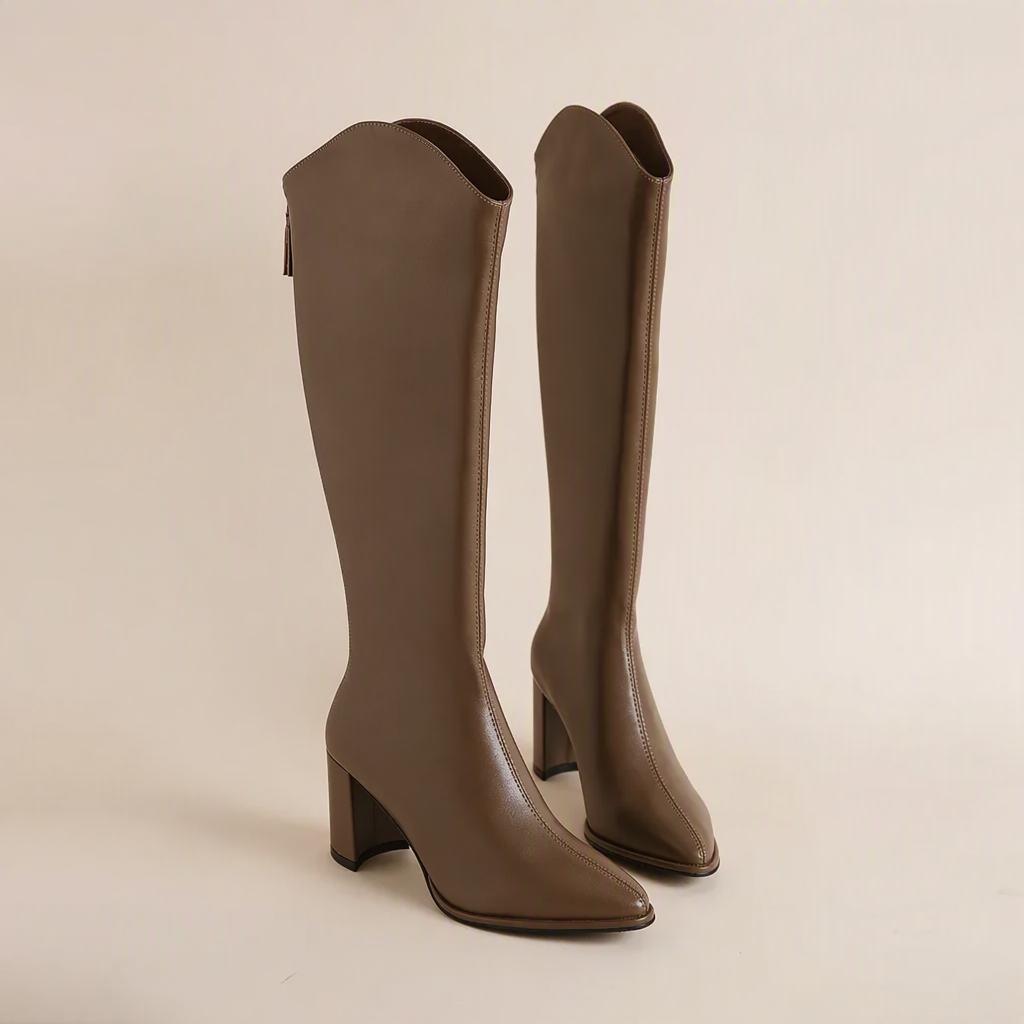 Women's black block heel knee-high boots with a sleek pointed toe & back zip closure for fall/winter.