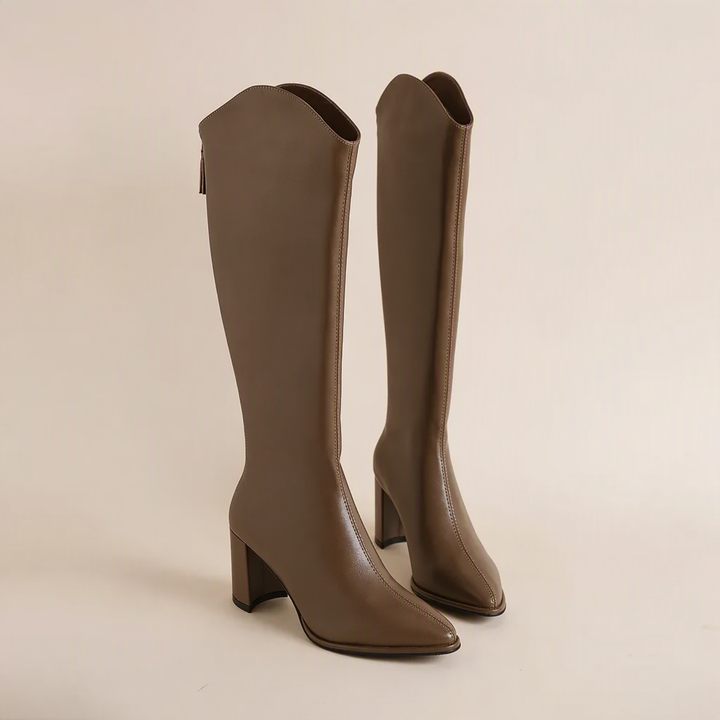 Women's black block heel knee-high boots with a sleek pointed toe & back zip closure for fall/winter.
