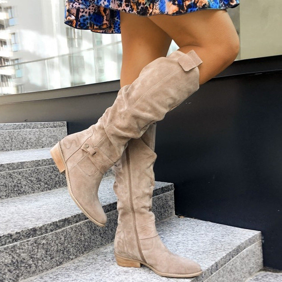 Comfortable women's knee high slouch boots with a stable block heel. Ideal elegant footwear for daily wear.