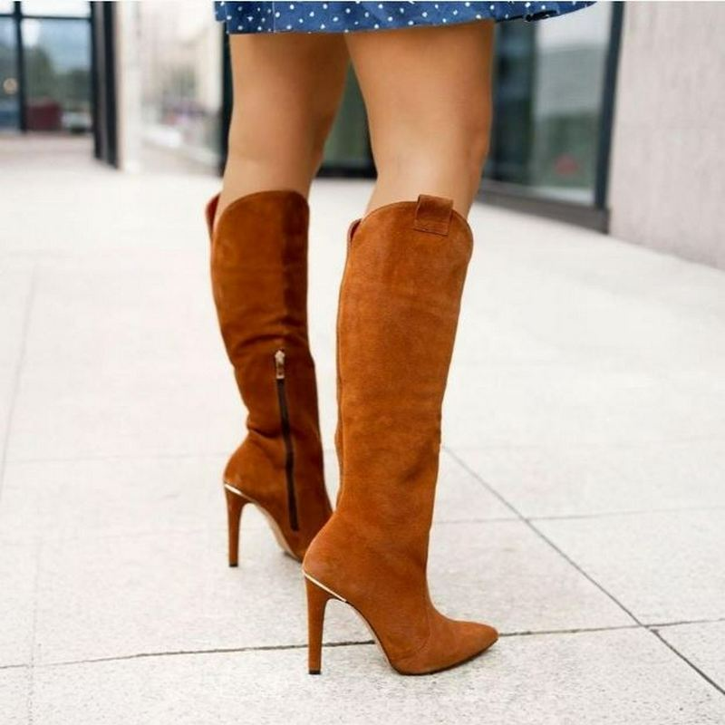 Statement-making women's knee-high boots with a chic pointed toe & a sky-high stiletto heel.