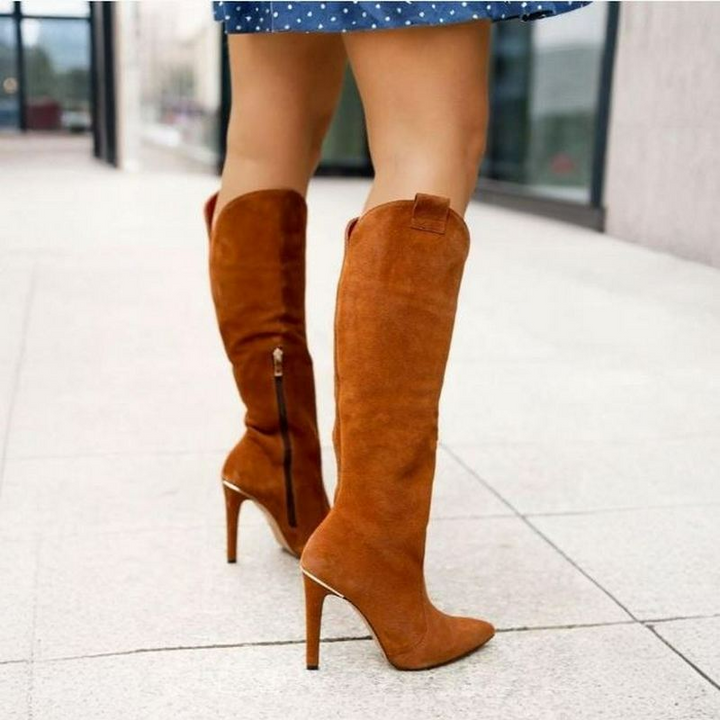 Statement-making women's knee-high boots with a chic pointed toe & a sky-high stiletto heel.