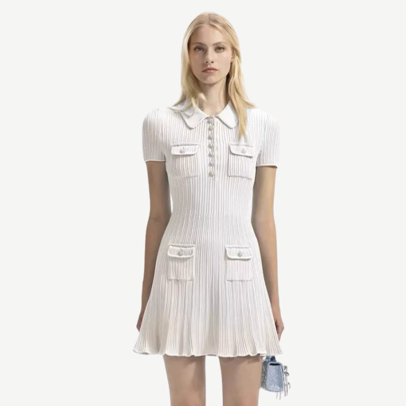 Detailed shot of women's ribbed knit polo mini dress, highlighting the texture, collar, and side pockets.
