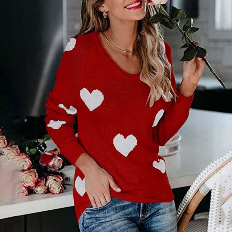 Long sleeve women's V-neck sweater with heart print. Casual, elegant, and warm knit.