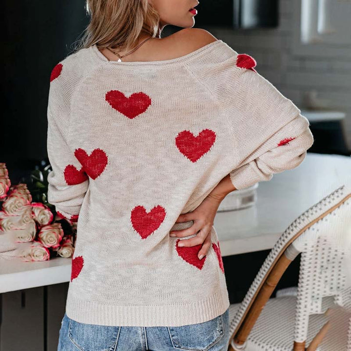 Cozy women's V-neck long sleeve sweater with cute heart print. Ideal for everyday style.