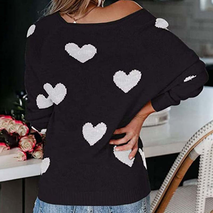 Stylish women's V-neck knit sweater with heart print for casual yet elegant winter wear.