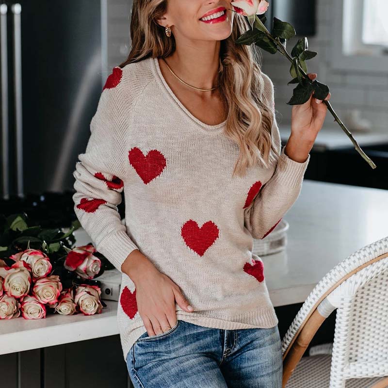 Elegant knit V-neck sweater for women, featuring a charming heart print. Casual & chic.