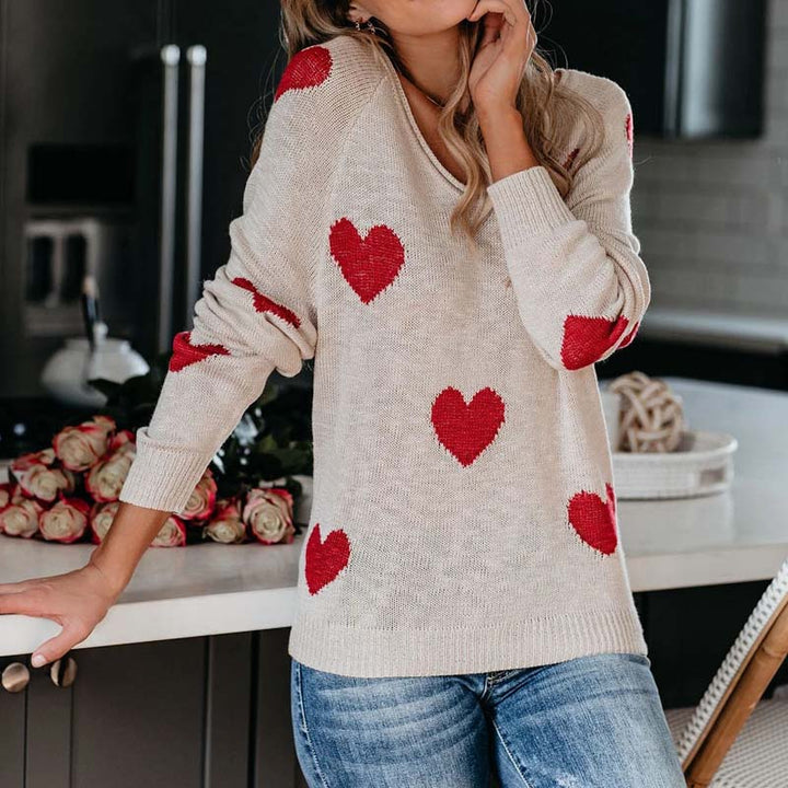 Chic women's V-neck sweater with a delightful heart print. Perfect for casual comfort.