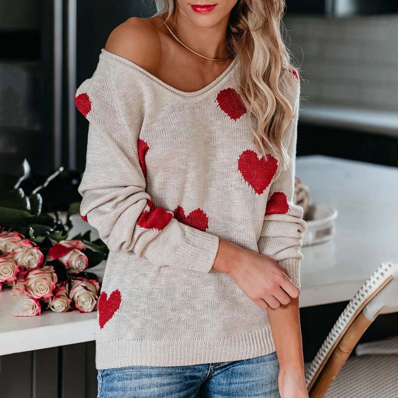 Casual women's knit sweater, V-neck, heart print design. Ideal for winter fashion.