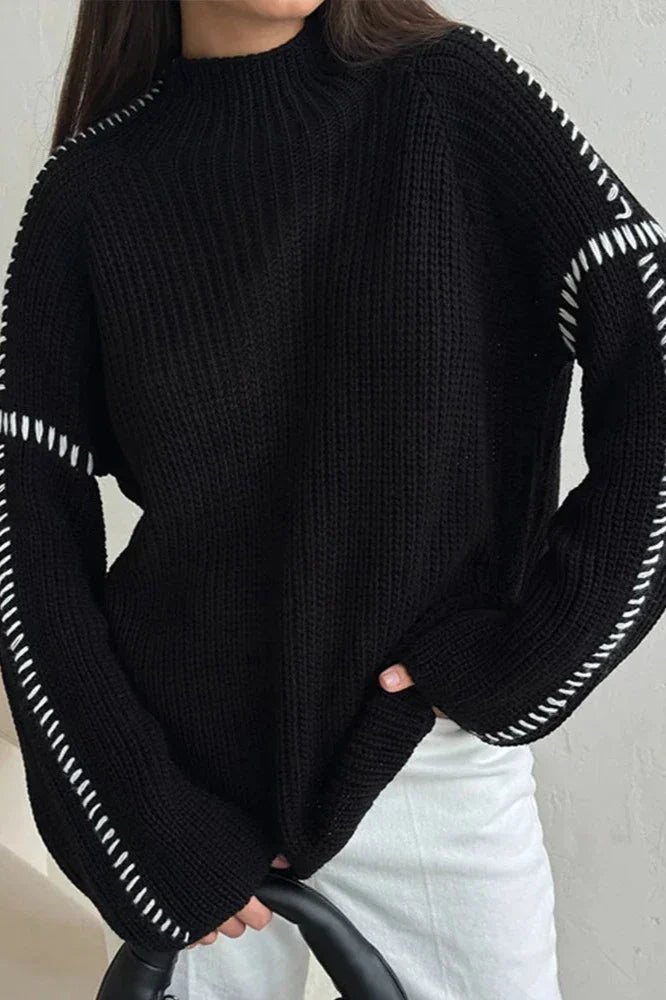 Chic women's oversized mock neck chunky knit sweater, ideal for winter fashion. Features a cozy relaxed fit.