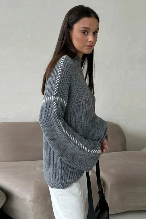 Women's oversized chunky knit jumper, a cozy mock neck sweater with fashionable contrast stitch detail.