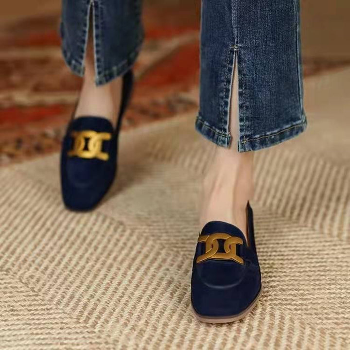 Navy blue women's loafers featuring a stylish chain detail, comfortable flats for elegant everyday wear.