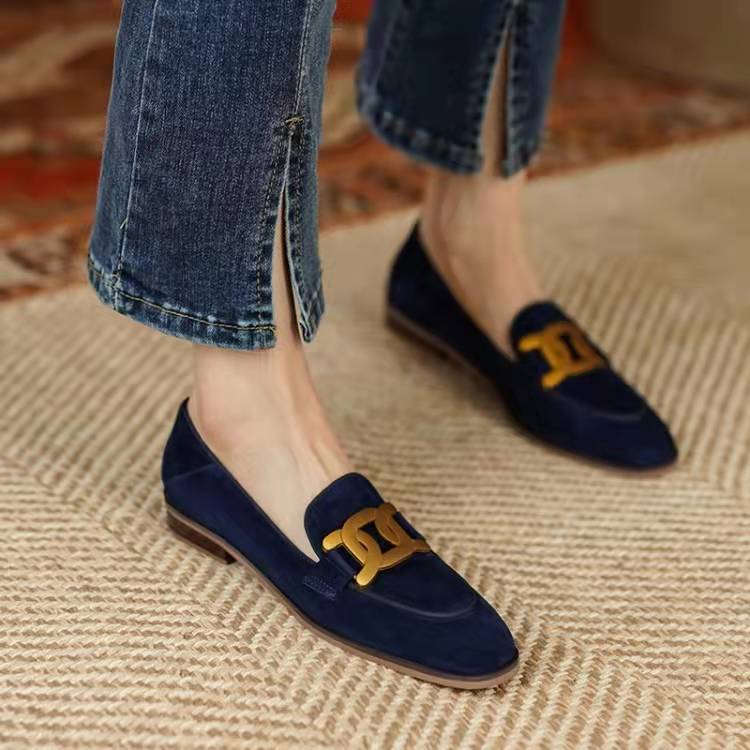 Beige women's slip-on loafers with delicate chain trim, versatile and comfortable elegant footwear.