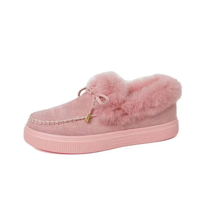 Side view of women's black platform loafers, showcasing thick sole & fluffy cozy interior.