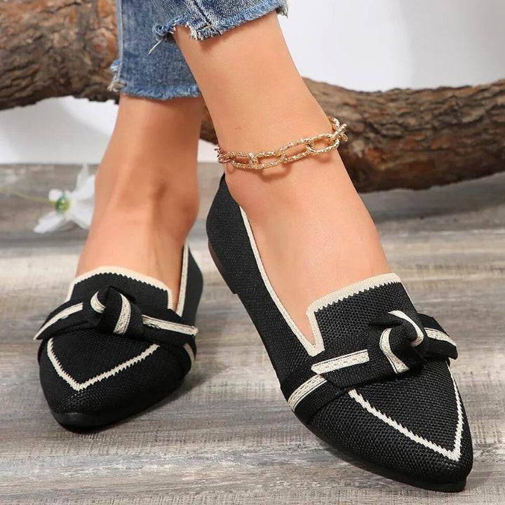 Elegant women's slip-on loafers, pointed toe, knot detail, comfortable for business casual.