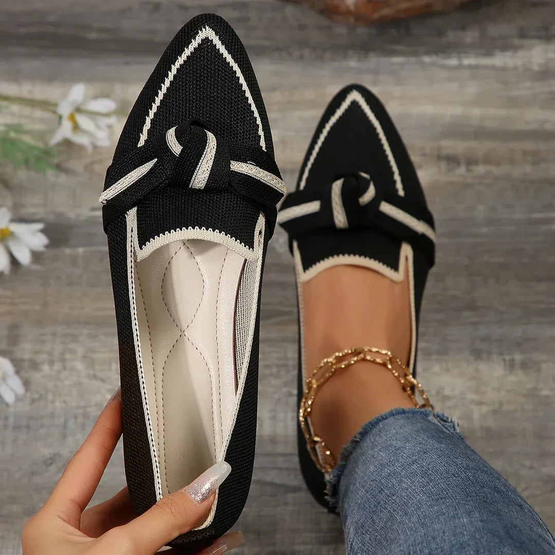 Women's pointed toe loafers with stylish knot detail.