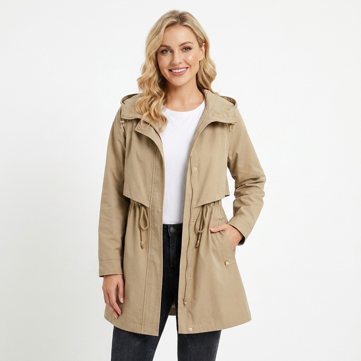 Fashionable women's long rain jacket with hood, offering waterproof protection. Versatile outerwear for rainy days.