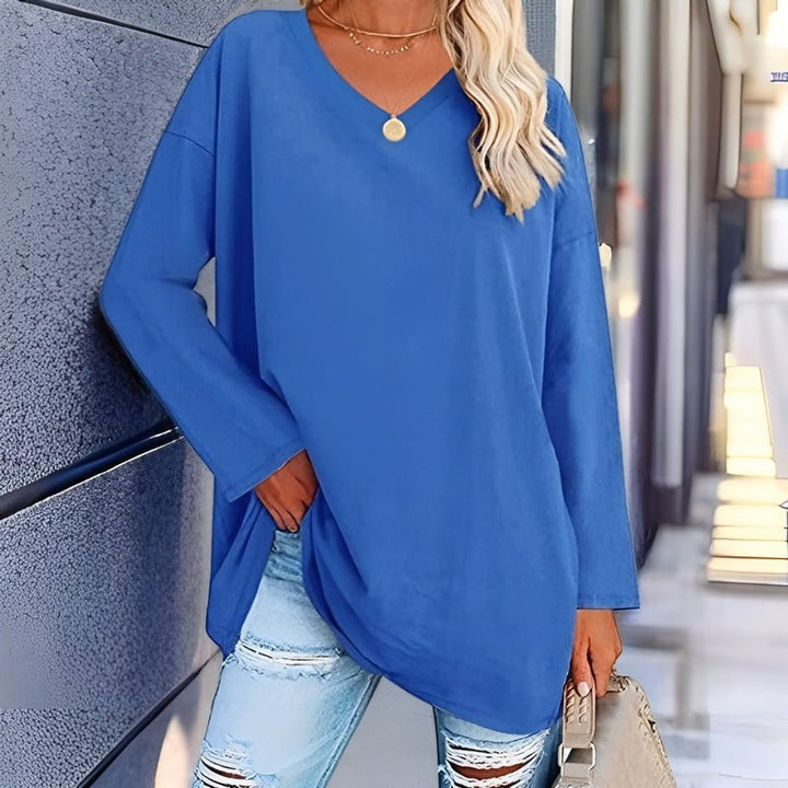 Stylish women's oversized long sleeve V-neck top, perfect for casual fall & spring fashion.