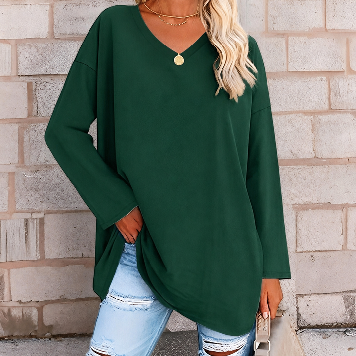 Comfortable women's v-neck long sleeve top with a relaxed oversized fit for versatile wear.