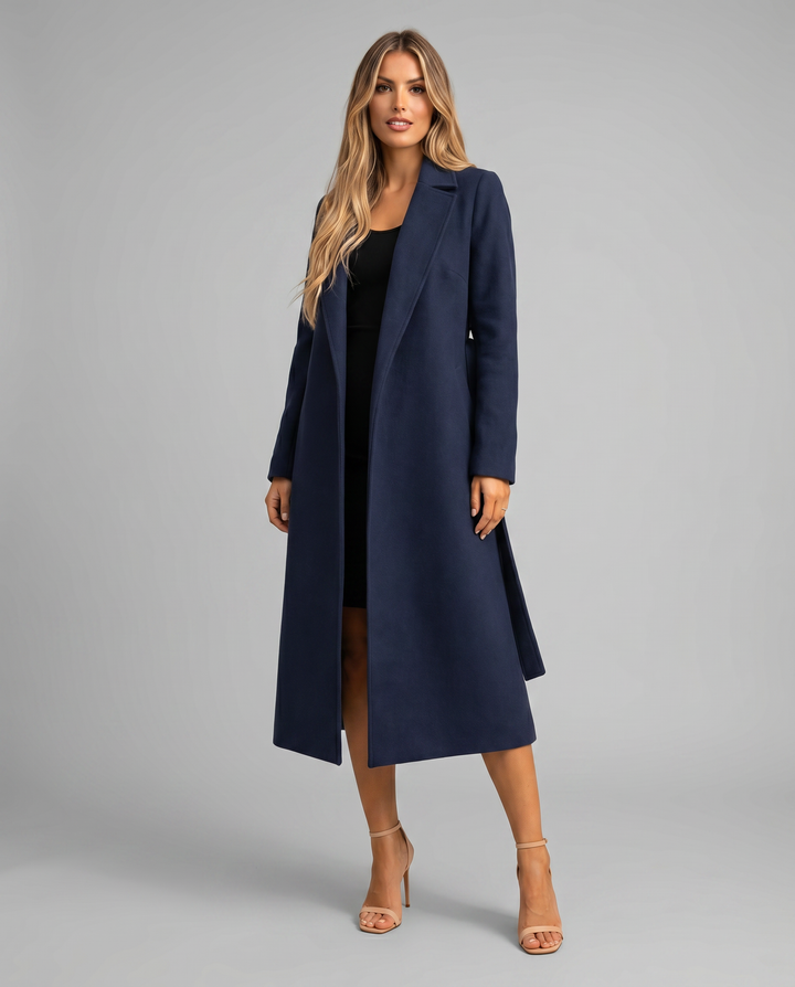 Women's long trench coat with a stylish tie belt & classic notched lapel. Elegant outerwear for versatile fashion.