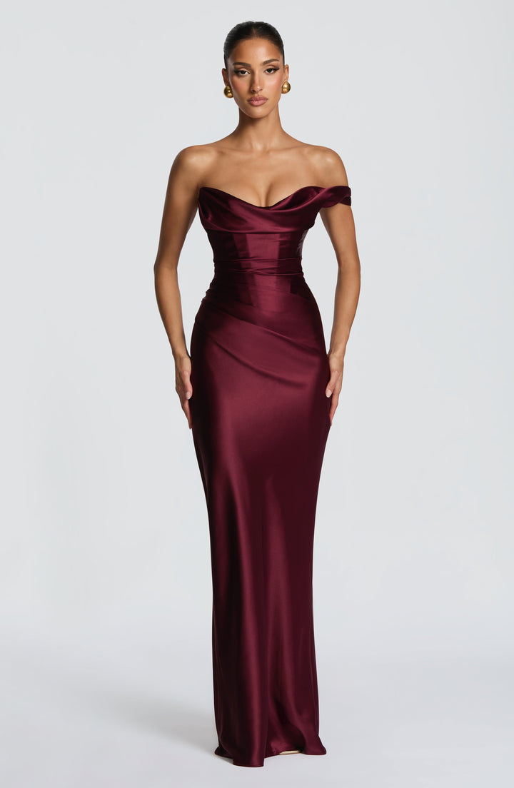Formal women's one-shoulder burgundy maxi evening gown with a flattering corset silhouette, ideal for galas & parties.