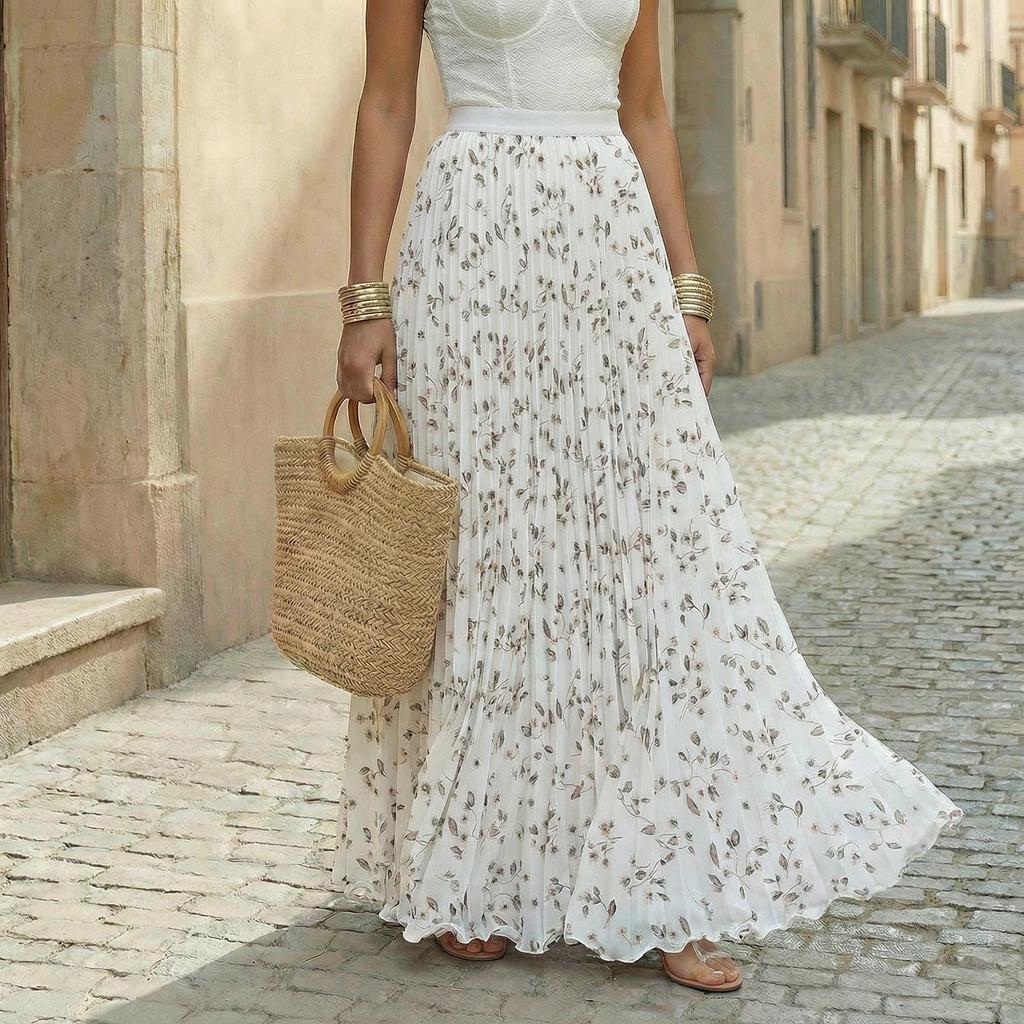 Women's pleated floral maxi skirt with a vibrant print, flowy and elegant for spring.