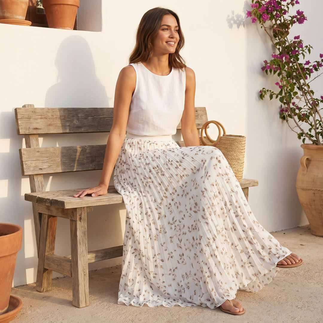 Comfortable women's flowy floral pleated maxi skirt, long design with elastic waist for summer.