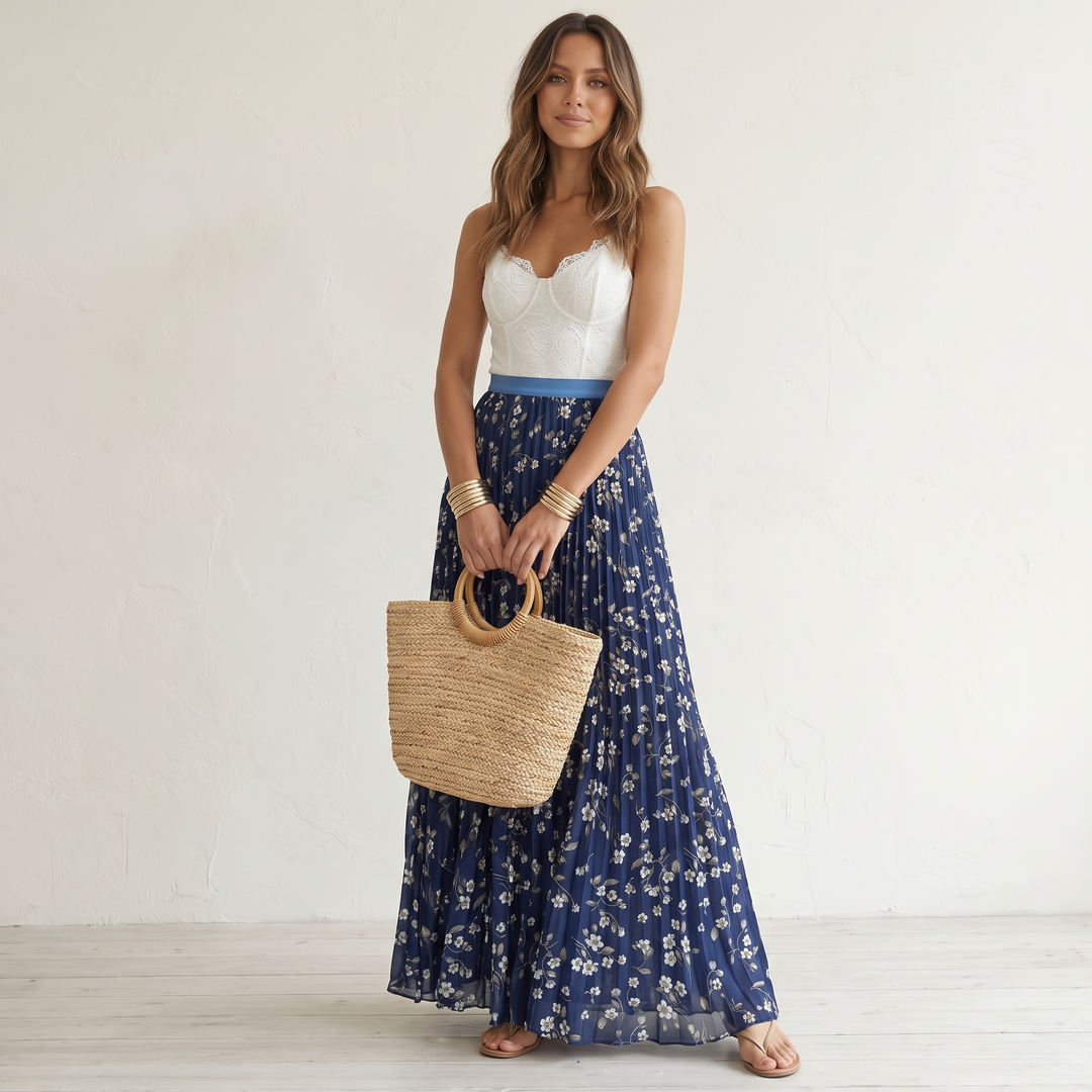 Spring style women's pleated floral maxi skirt, long and flowy, perfect for vacation wear.