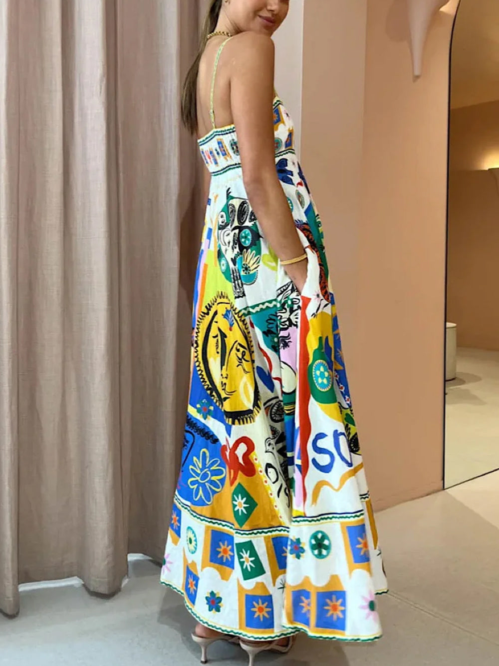 Artistic abstract print maxi sundress for women. Thin straps, comfortable flowing design for casual summer elegance.