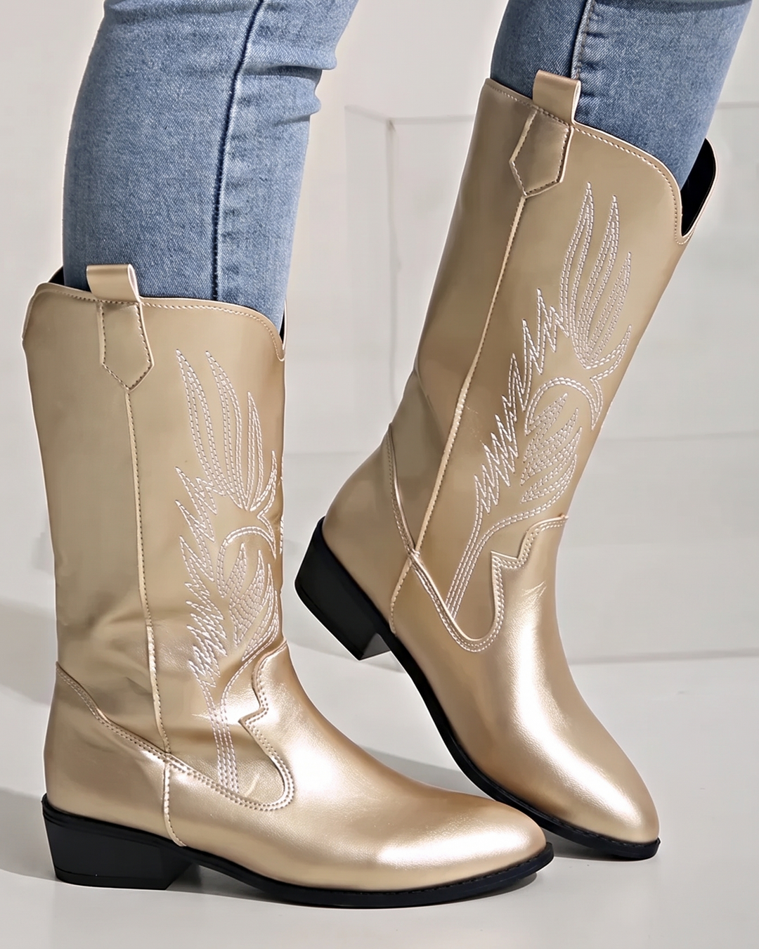 Embroidered women's mid-calf western boots. Stylish pointed toe cowgirl boots with comfortable block heel.