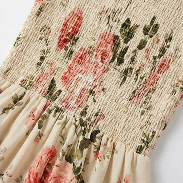 Lightweight women's floral smocked midi dress with tiers and ruffle neck, perfect for warm spring days.