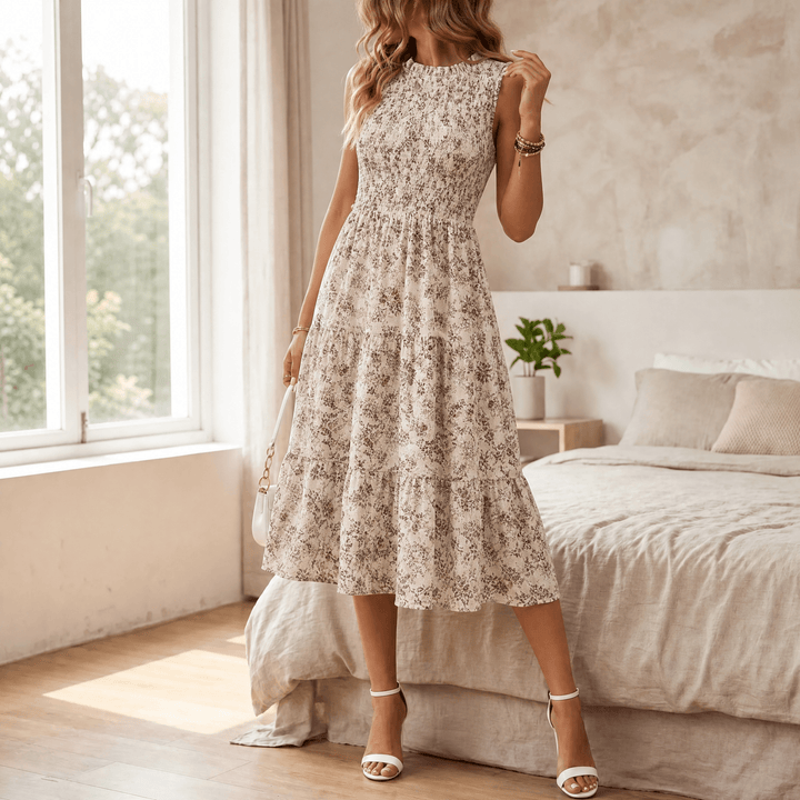 Charming floral print women's midi dress with smocked bodice, tiered skirt, and ruffled collar.