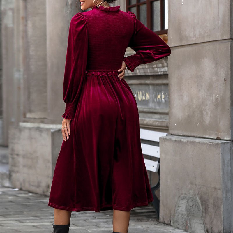 Women's sophisticated wine red V-neck long sleeve midi dress with shirred bodice and pleated skirt.