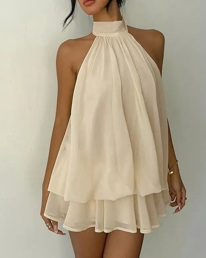 Party fashion: women's halter mini dress, open back detail, and a playful tiered skirt.