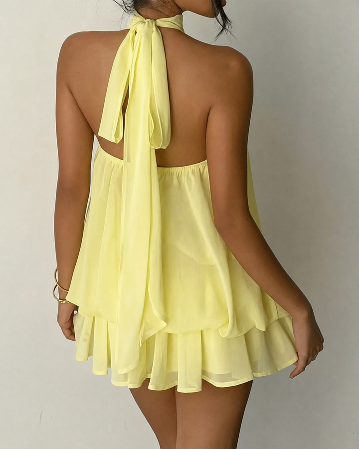 Effortless party style: women's sleeveless halter mini dress with an open back.