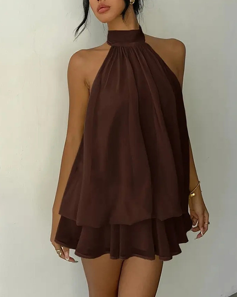 Party-ready women's flowy mini dress with a chic halter neck and tiered design.