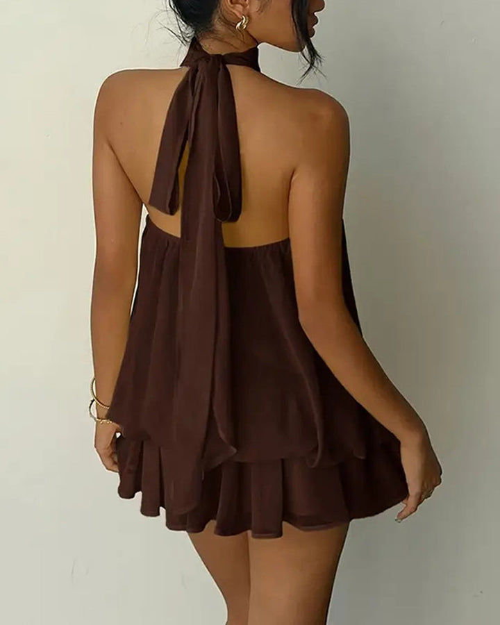 Casual chic women's mini dress, sleeveless with a halter neck and comfortable flowy fit.