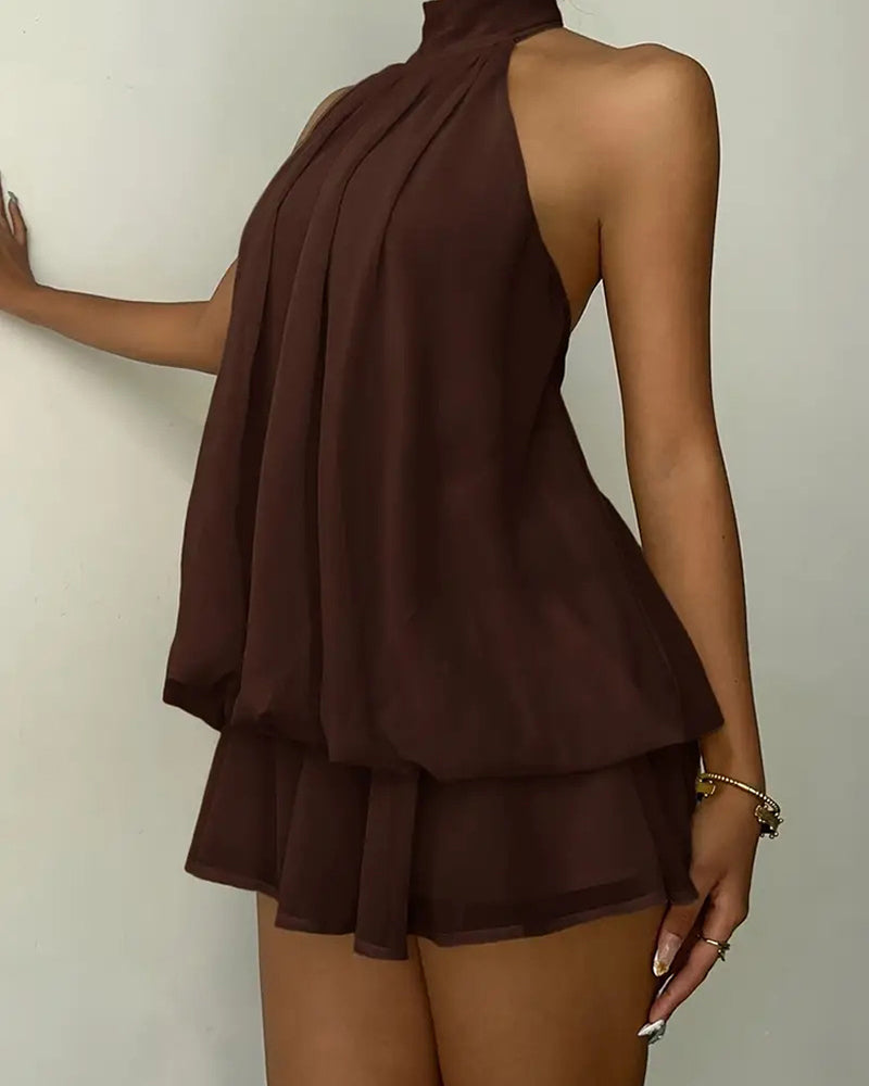 Elegant women's cocktail mini dress, halter neck and open back for summer evenings.