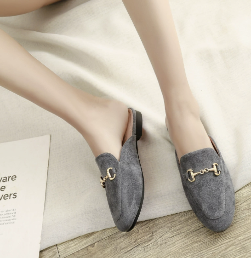 Fashionable women's pointed-toe chain buckle mules for versatile styling, from casual outfits to dressy ensembles.