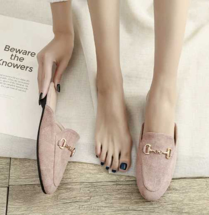Comfortable women's slip-on pointed toe mules featuring a chic chain buckle. Ideal elegant everyday footwear.