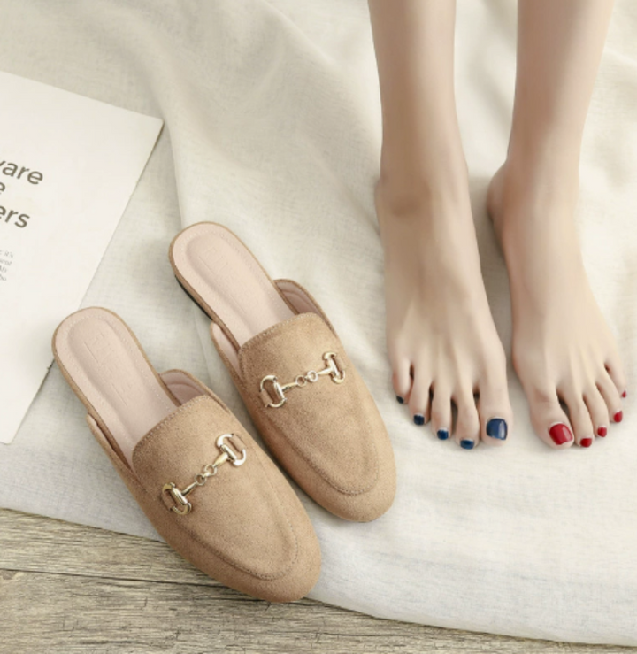 Sophisticated women's pointed toe mules with chain buckle, offering slip-on elegance for work, casual, or dressy events.