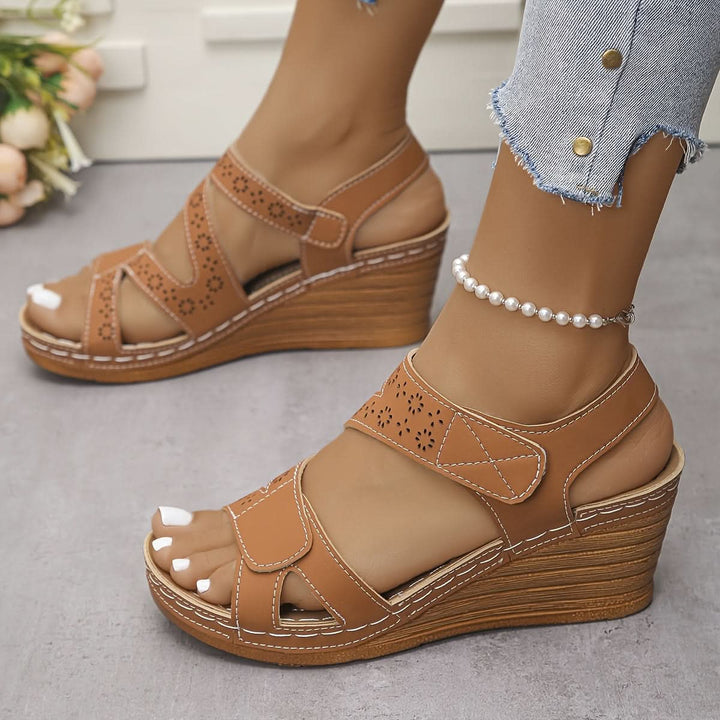 Fashion-forward women's platform wedges, open toe, with a unique cutout design and supportive ankle strap.
