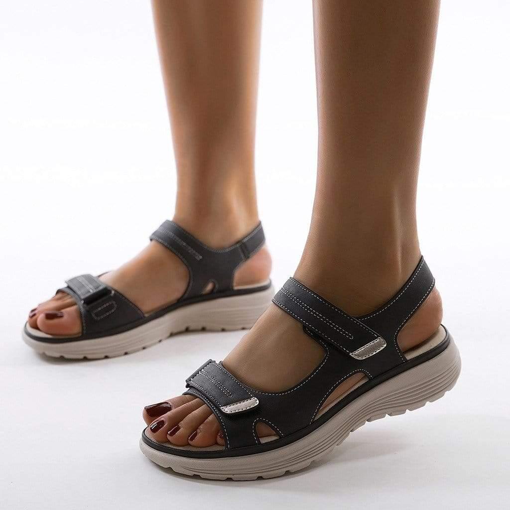 Ergonomic women's travel sandals with arch support, wide toe box, and adjustable fit for bunion relief.