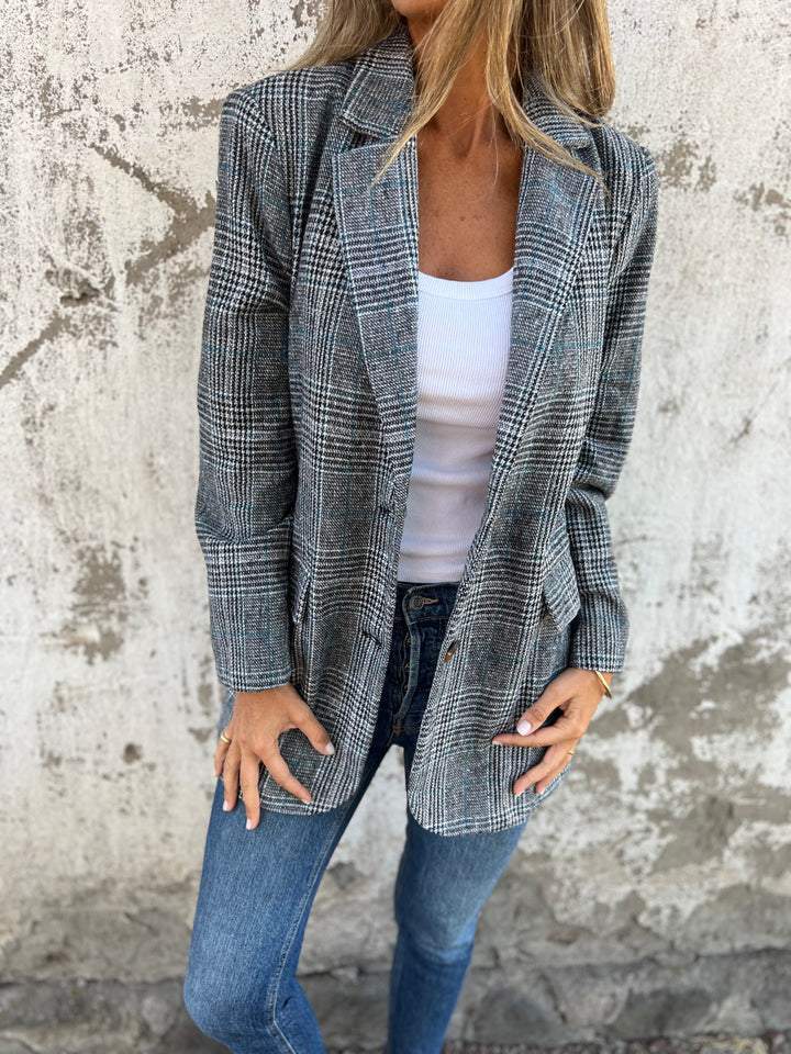 Classic women's oversized houndstooth blazer, a versatile long jacket with a notched lapel for chic office style.
