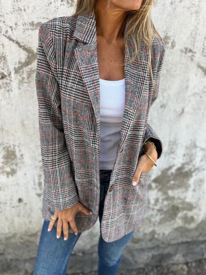 Fashionable women's oversized houndstooth blazer, a chic notched lapel jacket for smart casual & office looks.