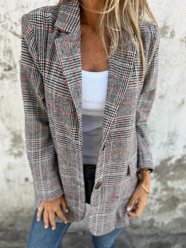 Elegant women's long oversized houndstooth blazer with notched lapel, a chic and versatile outerwear piece.