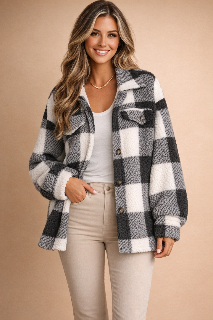 Comfortable women's plaid shirt jacket with button front. Loose fit casual outerwear, ideal for everyday fall fashion.