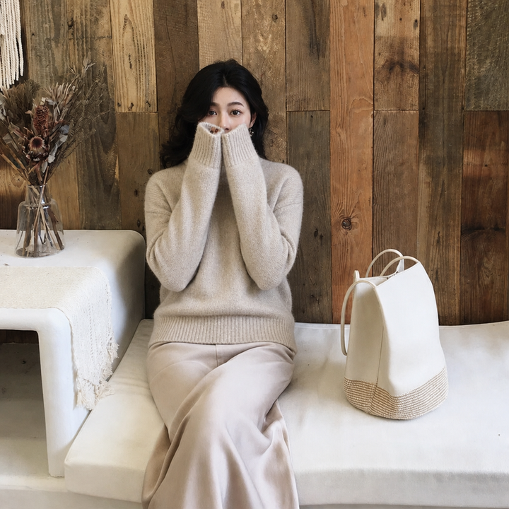 Women's oversized fluffy crew neck jumper with balloon sleeves. Ideal cozy winter sweater for women's fashion.